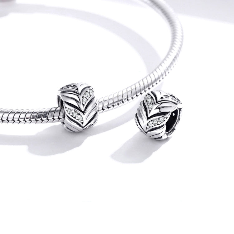Snake-chain bracelet with two wheat heart charm beads, CZ stones, and black enamel