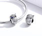 Silver snake bracelet with two oxidized owl charms and blue CZ eyes