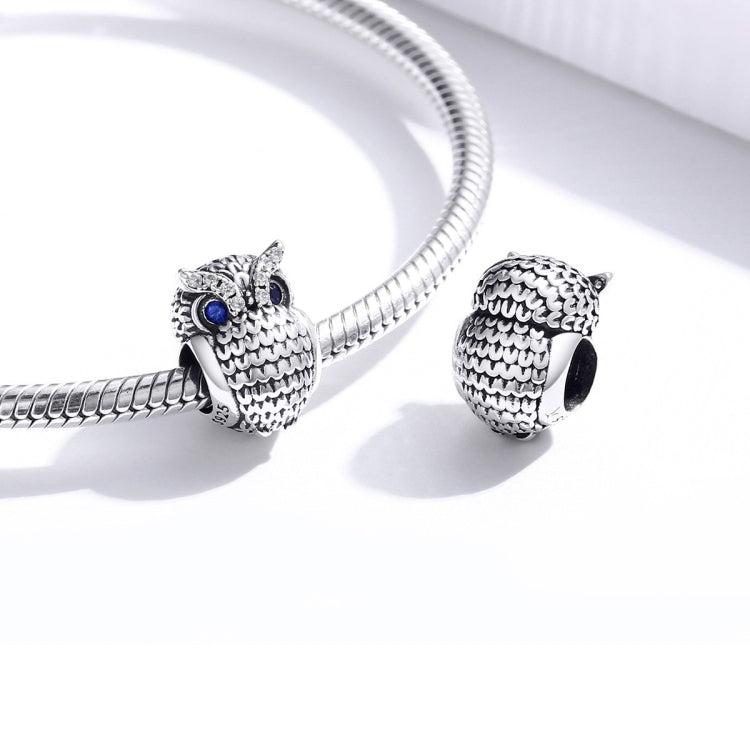 Silver snake bracelet with two oxidized owl charms and blue CZ eyes
