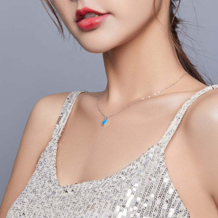 Sterling silver heart necklace with deep blue pendant on fine chain