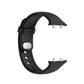 Black silicone watch strap with gray buckle loop and connector end visible
