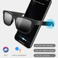 Black smart audio glasses with dark lenses, shown with a smartphone voice assistant app.