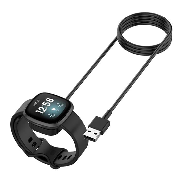 Black magnetic watch charging cable connected to a smartwatch, with USB-A plug