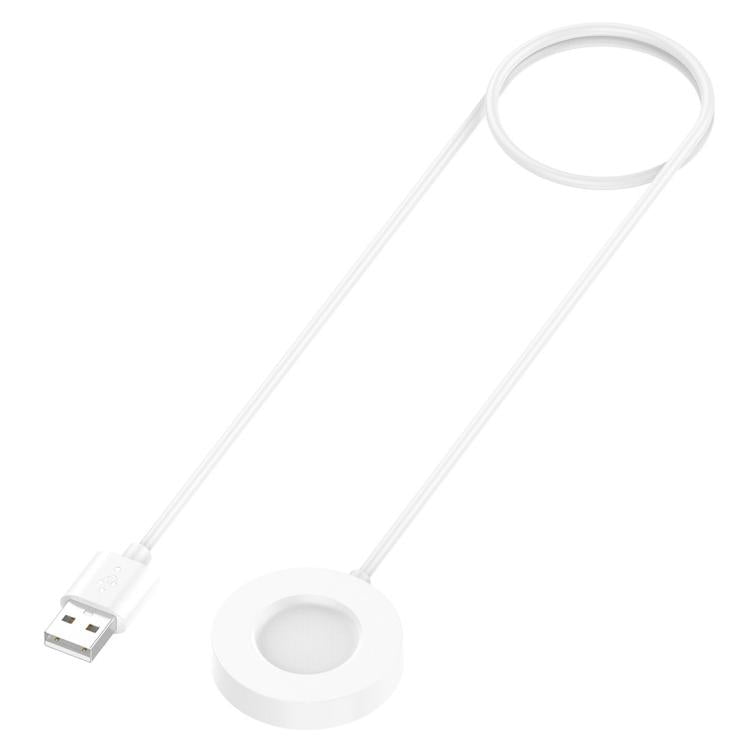 xDfind white magnetic watch charger cable coiled beside its round charging pad
