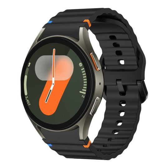 Black silicone watch band with wavy ridges and colored accents, shown on a smartwatch