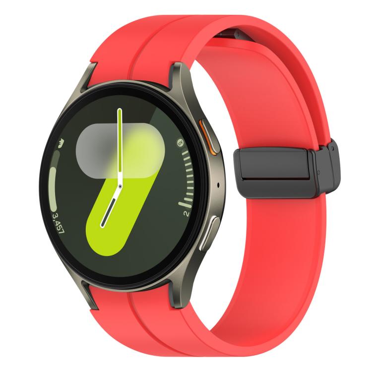 Red silicone Samsung watch band with black magnetic buckle on a smartwatch