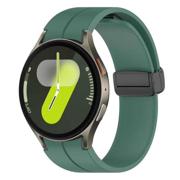 Pine green silicone watch band with black magnetic buckle on a round smartwatch