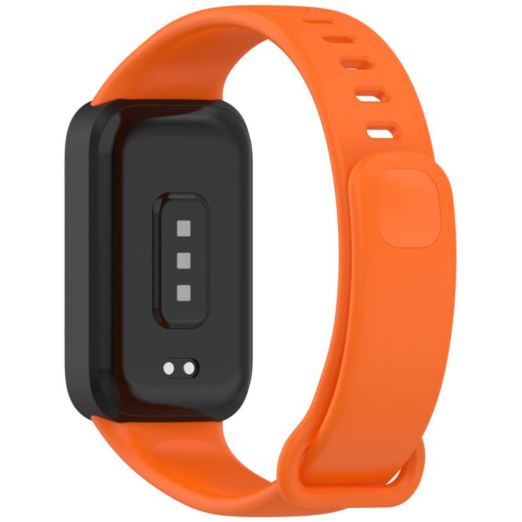 Back of orange silicone watch band showing tracker sensor opening and adjustable strap