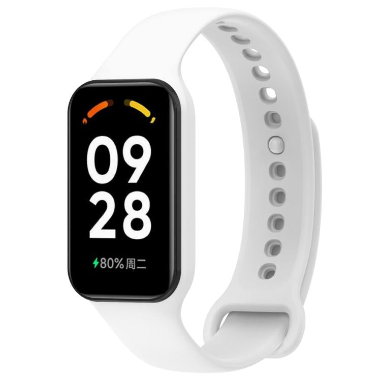 White silicone watch band with black fitness tracker and perforated adjustable strap