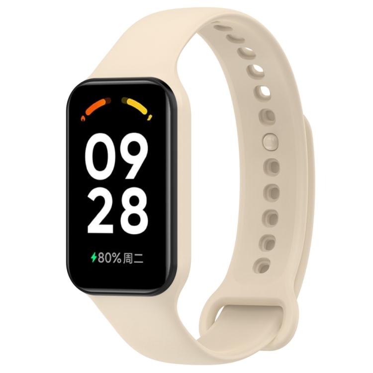 Cream silicone watch band with black fitness tracker and perforated adjustable strap