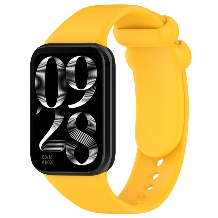 Yellow silicone smartwatch band with buckle, shown attached to a black smartwatch