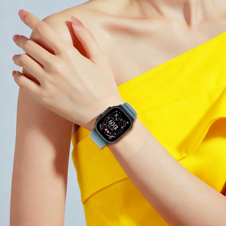 Light blue nylon loop watch band worn on a wrist