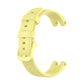 Yellow silicone watch band with adjustable holes, buckle, and keeper