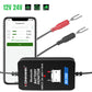 Black battery monitor with red and black U-shaped battery clips and smartphone test screen