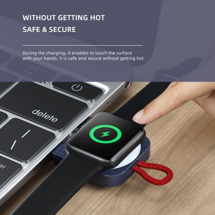 Black portable magnetic wireless watch charger with green power icon and red braided cord