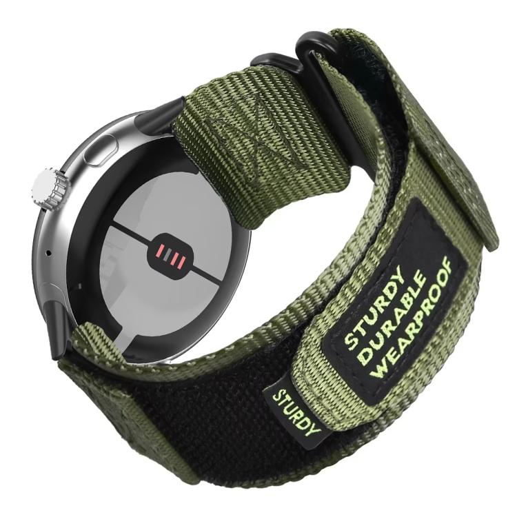 Olive green nylon watch band with hook-and-loop closure and quick-release connectors, shown on a smartwatch.