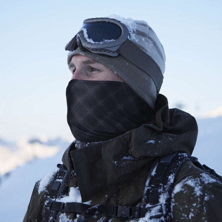 Dark hooded wind scarf covering face and neck, worn outdoors in snow