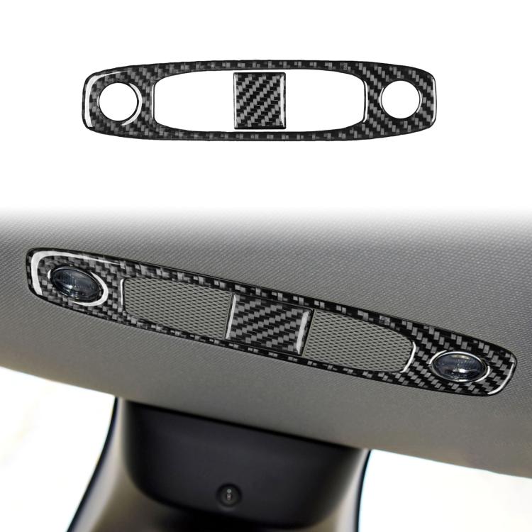 Black carbon-fiber reading light panel cover with two round cutouts and center insert