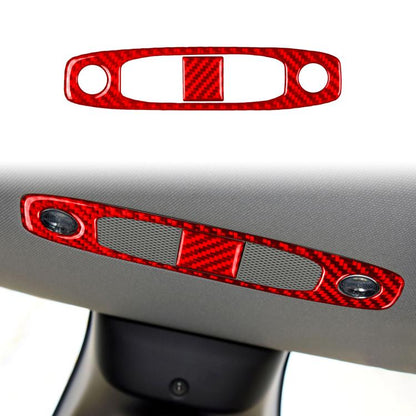 Red carbon-fiber reading light panel cover with two round cutouts and center insert