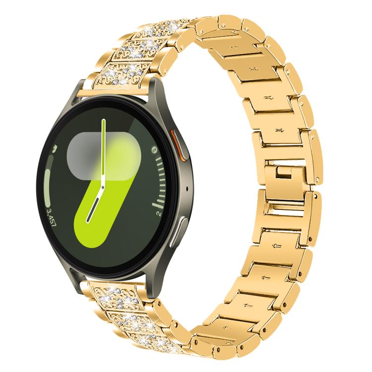 Gold jeweled stainless steel watch band fitted to a round smartwatch with a bright dial