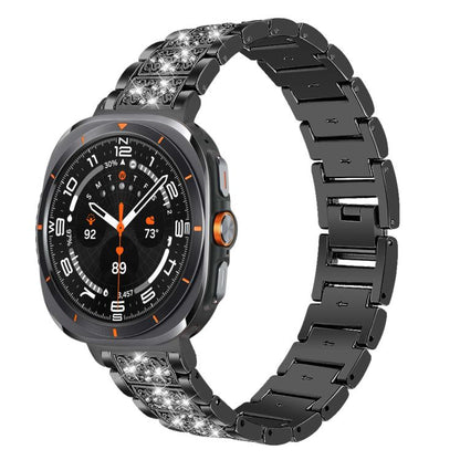Black stainless steel watch band with crystal accents on a round smartwatch