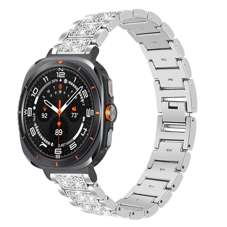 Silver stainless steel watch band with crystal accents on a round smartwatch