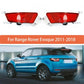 Two red rear bumper fog lights with clear lenses and mounting base