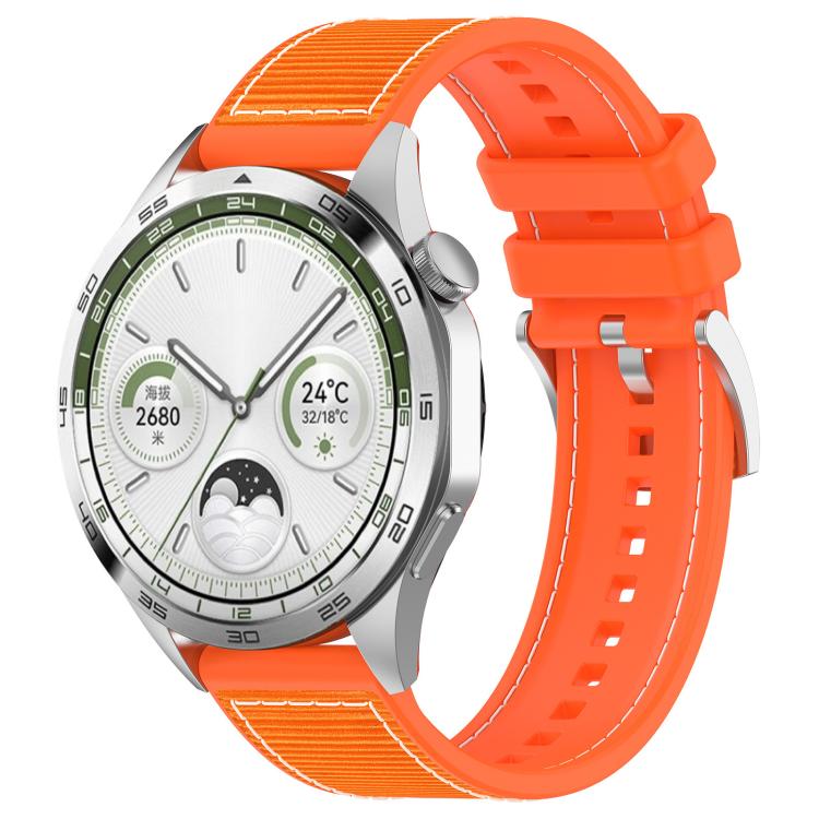Orange hybrid nylon and silicone watch band with stitched panels and adjustable holes, shown on a watch.