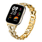 Gold-tone metal smartwatch band with rhinestone-set twisted links and geometric chain links.