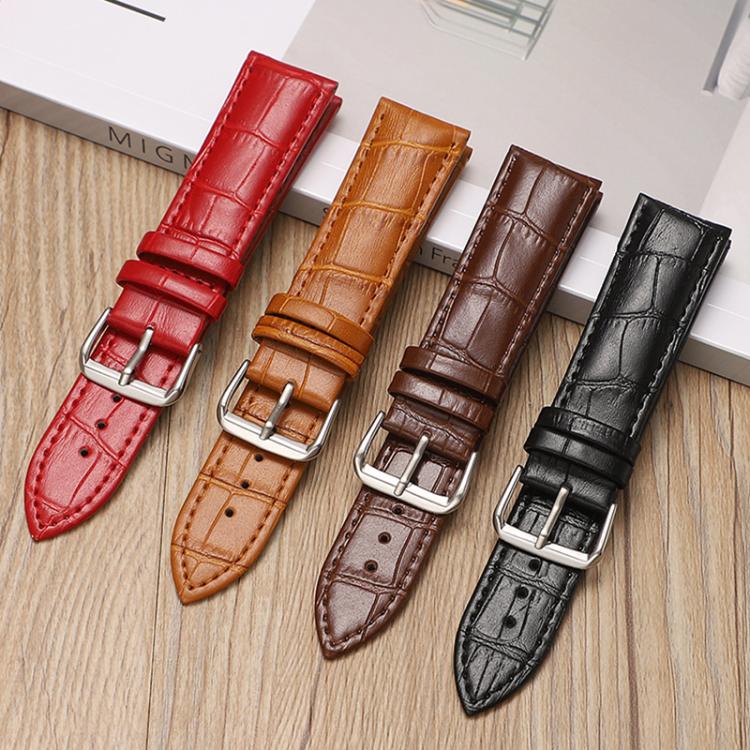 Four crocodile-textured leather watch bands with silver pin buckles in red, tan, brown, and black.