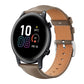Taupe leather watch band with contrast stitching and a silver buckle on a round smartwatch.