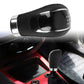 Black leather gear shift knob on manual car gear lever with chrome trim
