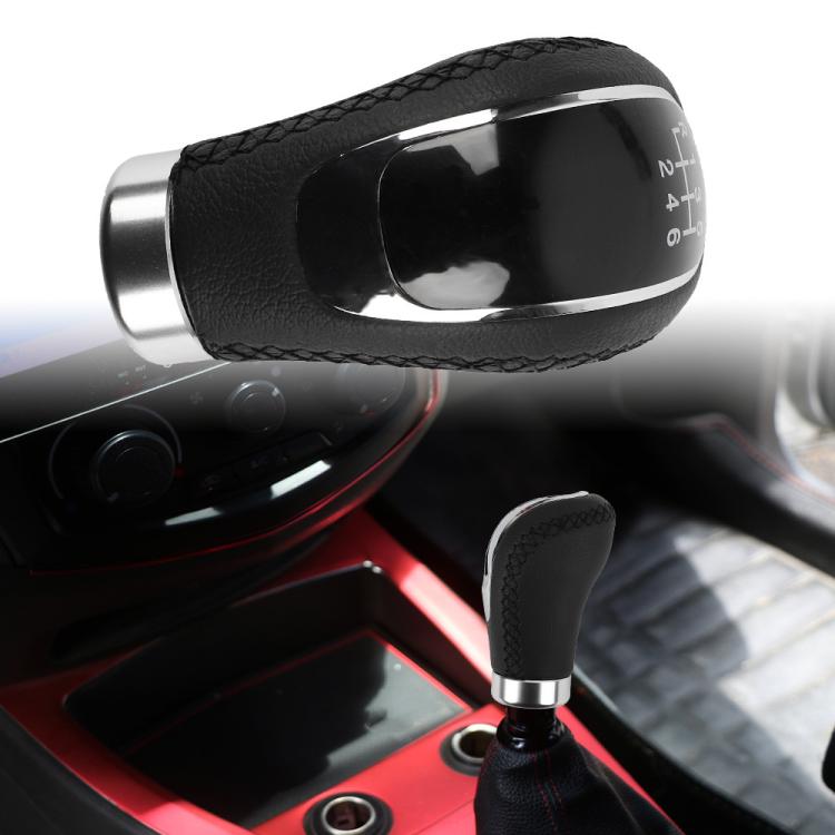 Black leather gear shift knob on manual car gear lever with chrome trim