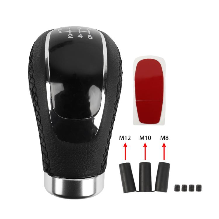 Black leather gear shift knob with chrome top, red-tinted shift insert, and parts