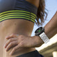 Silver titanium alloy watch band worn on a wrist