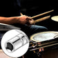 Drum tuning key with square socket near snare hardware and tom components