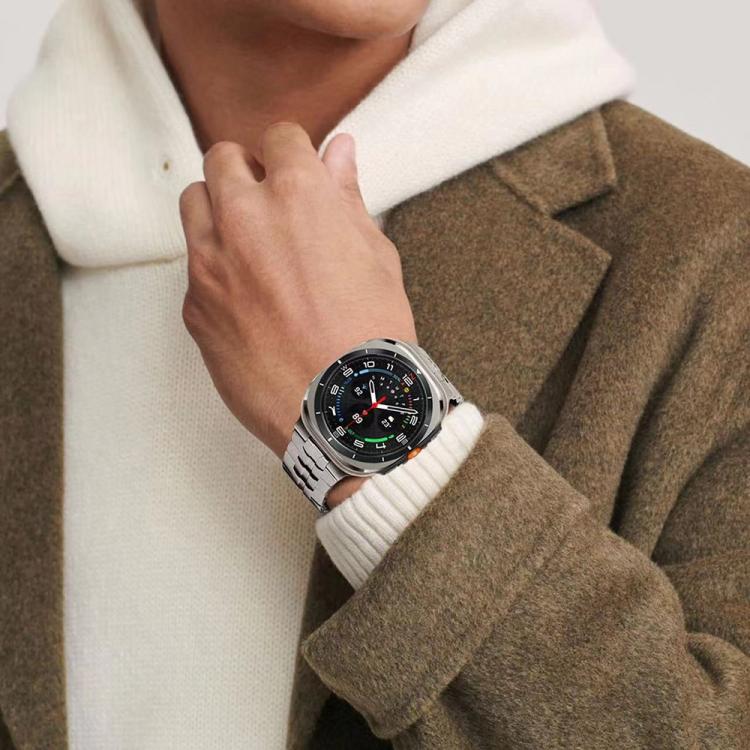 Silver link watch band worn on the wrist