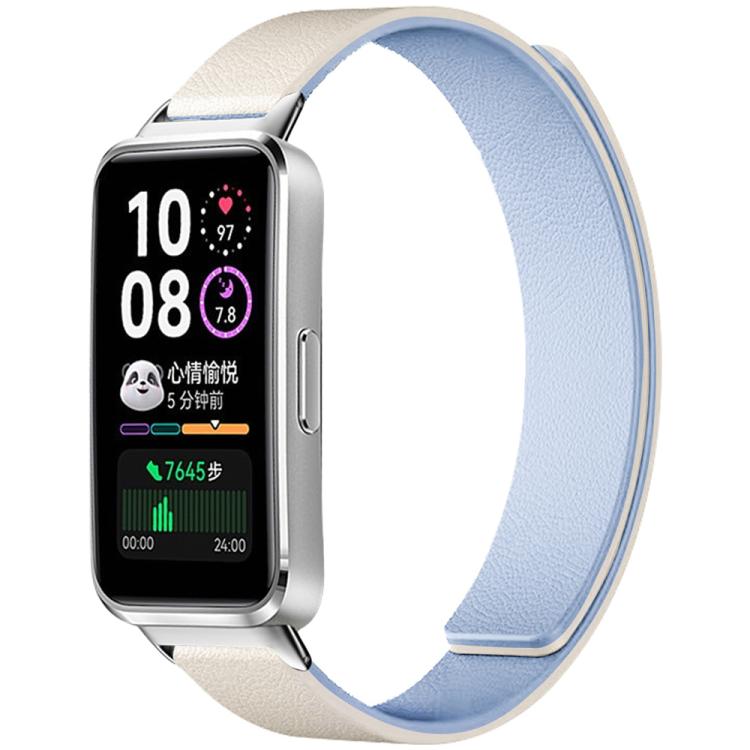 Magnetic silicone watch band with cream exterior and pale blue lining, shown attached to a smartwatch.