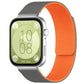 Textured silicone watch band in gray and orange, shown fitted to a smartwatch.