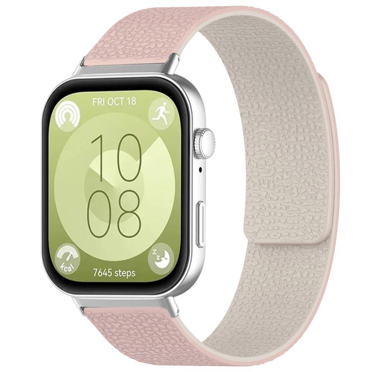 Textured silicone watch band in pink and cream, shown fitted to a smartwatch.