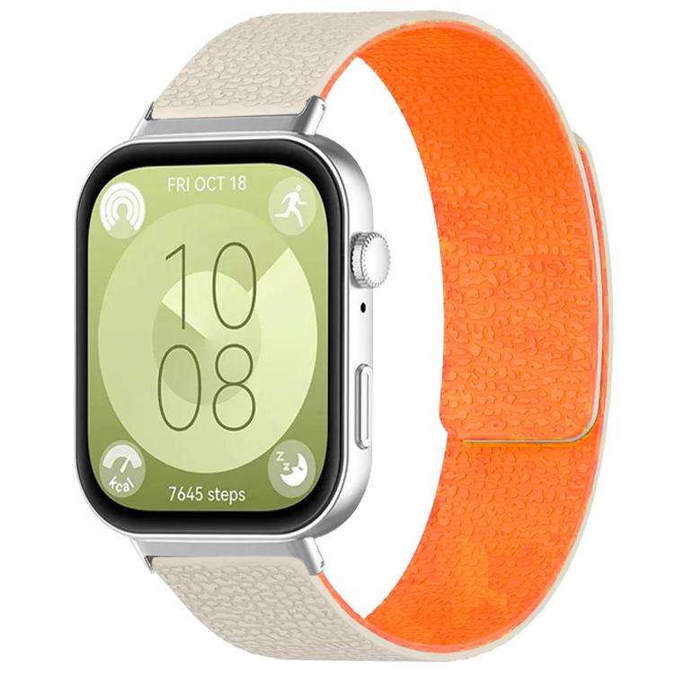 Textured silicone watch band in cream and bright orange, shown fitted to a smartwatch.