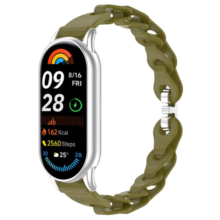 Olive green hollow-link silicone watch band fitted to a smartwatch.
