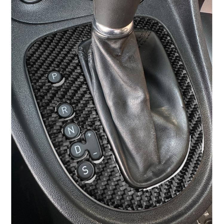 Black carbon fiber gear position panel sticker installed on car center console