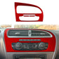 Red carbon-fiber center console trim panel around air vents and climate control dials