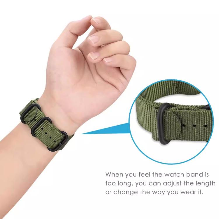 Green woven nylon watch band worn on a wrist with an adjustable buckle detail