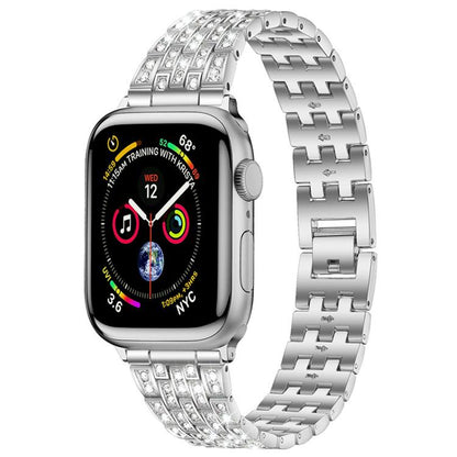 xDfind silver metal Apple Watch band with five rows of clear stones, shown attached to a watch