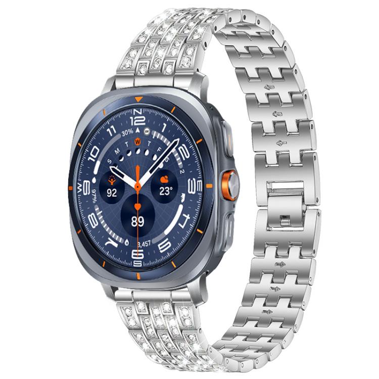 Silver five-row metal watch band with clear stones, shown on a smartwatch with a dark blue dial.