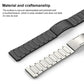 Close-up of black and silver linked stainless steel watch bands and folding clasps