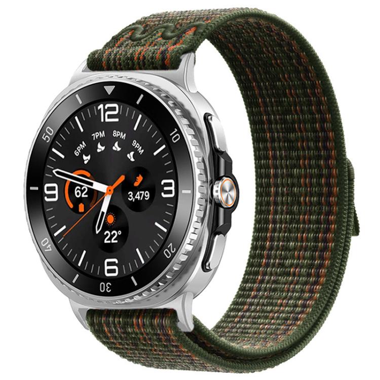 Nylon hook-and-loop watch band in dark green with orange flecks, shown on a silver watch.