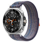 Nylon hook-and-loop watch band in royal blue with orange flecks, shown on a silver watch.